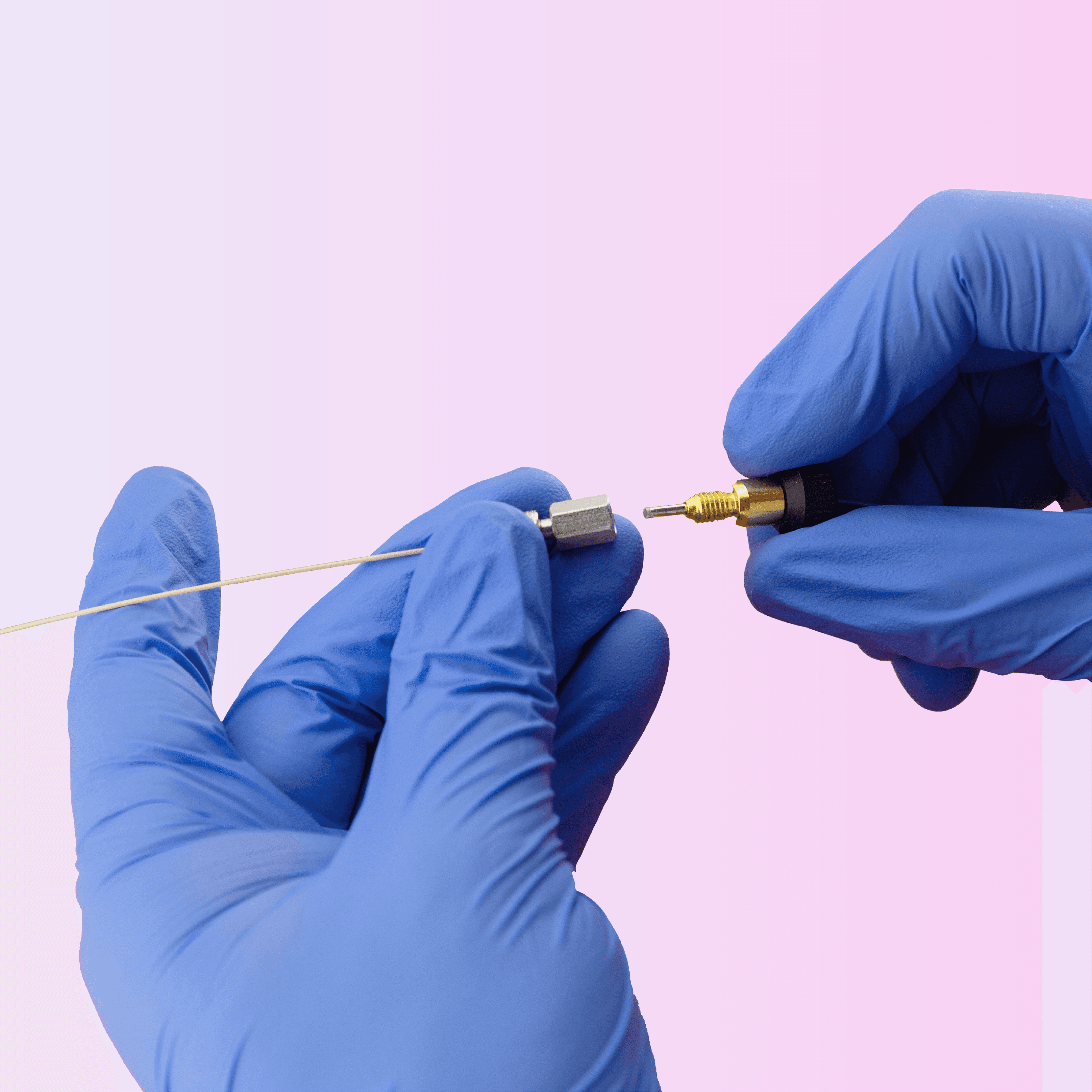 Gloved hands carefully connect a thin golden wire to a small metallic connector.